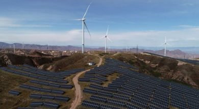 Wind turbines and solar panels are seen at a wind and solar power plant in Zhangjiakou