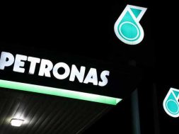 Petronas logos are pictured at a fuel station in Kuala Lumpur