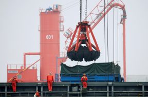 FILE PHOTO: Coal is loaded into a bulk carrier at Qingdao Port Shandong province