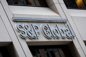 FILE PHOTO: The S&P Global logo is displayed on its offices in the financial district in New York