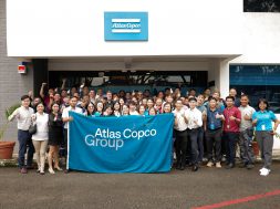 Group photo of Atlas Copco staff and partners
