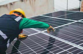 solar-technician-installing-solar-panel-stockpack-pexels-scaled_Rooftop_Solar